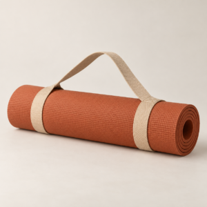 Terracotta rolled yoga mat with carry strap